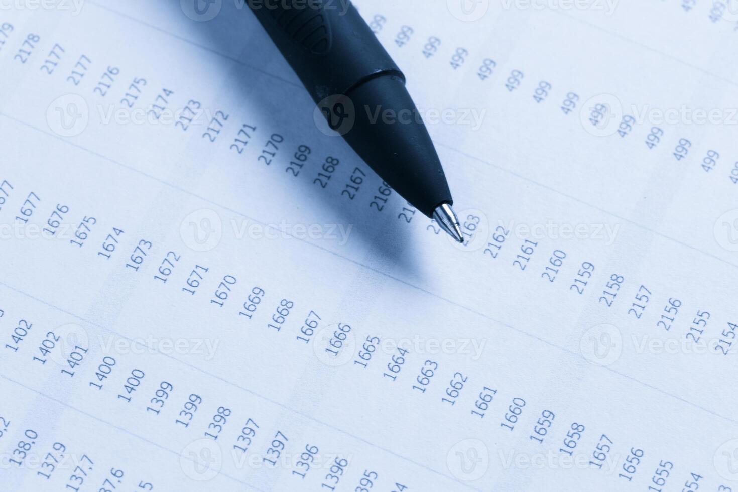 Business performance graph with ballpoint pen photo