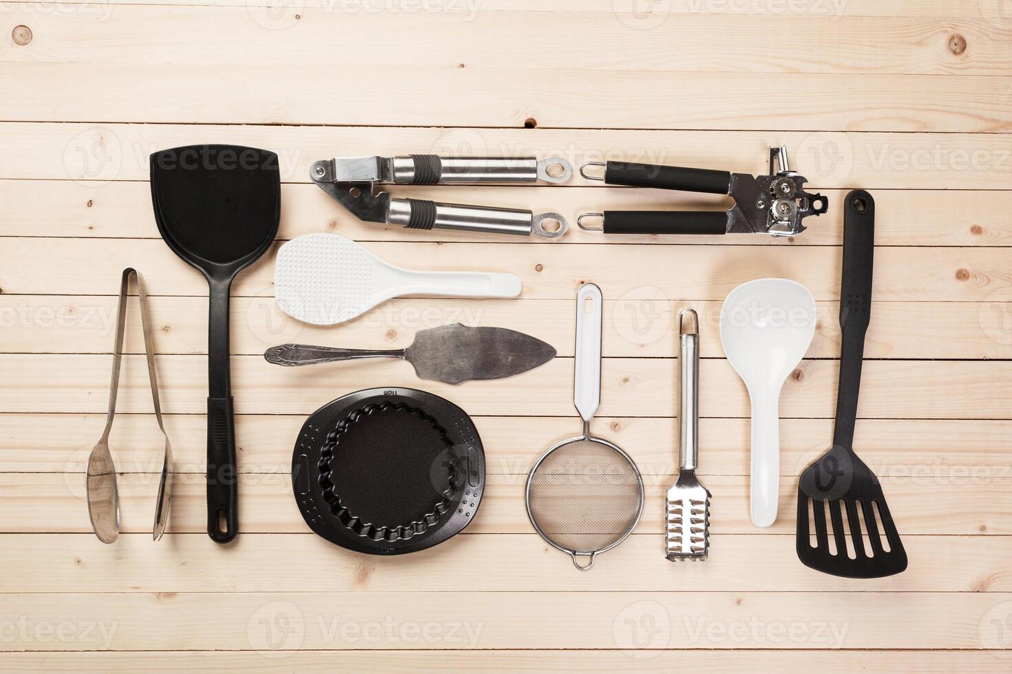 cookware and accessories on a wooden table. photo