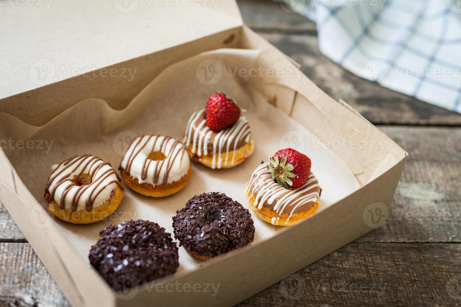 Colorful donuts in box photo