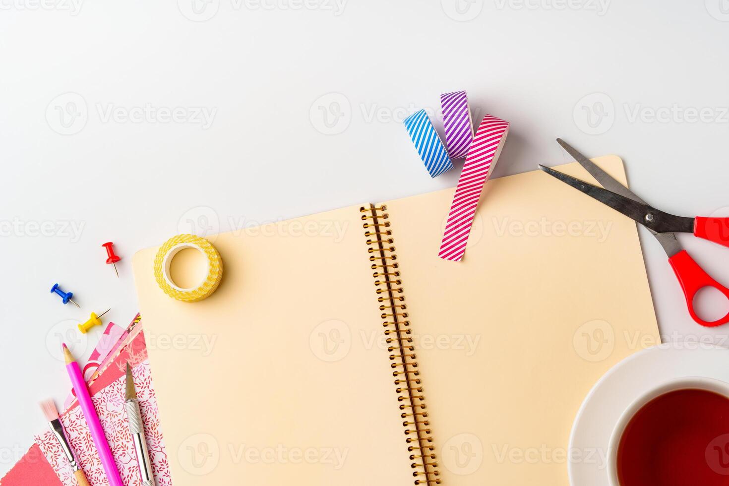 Creative workspace setup features colorful supplies and notebook for DIY projects in a bright, organized environment photo