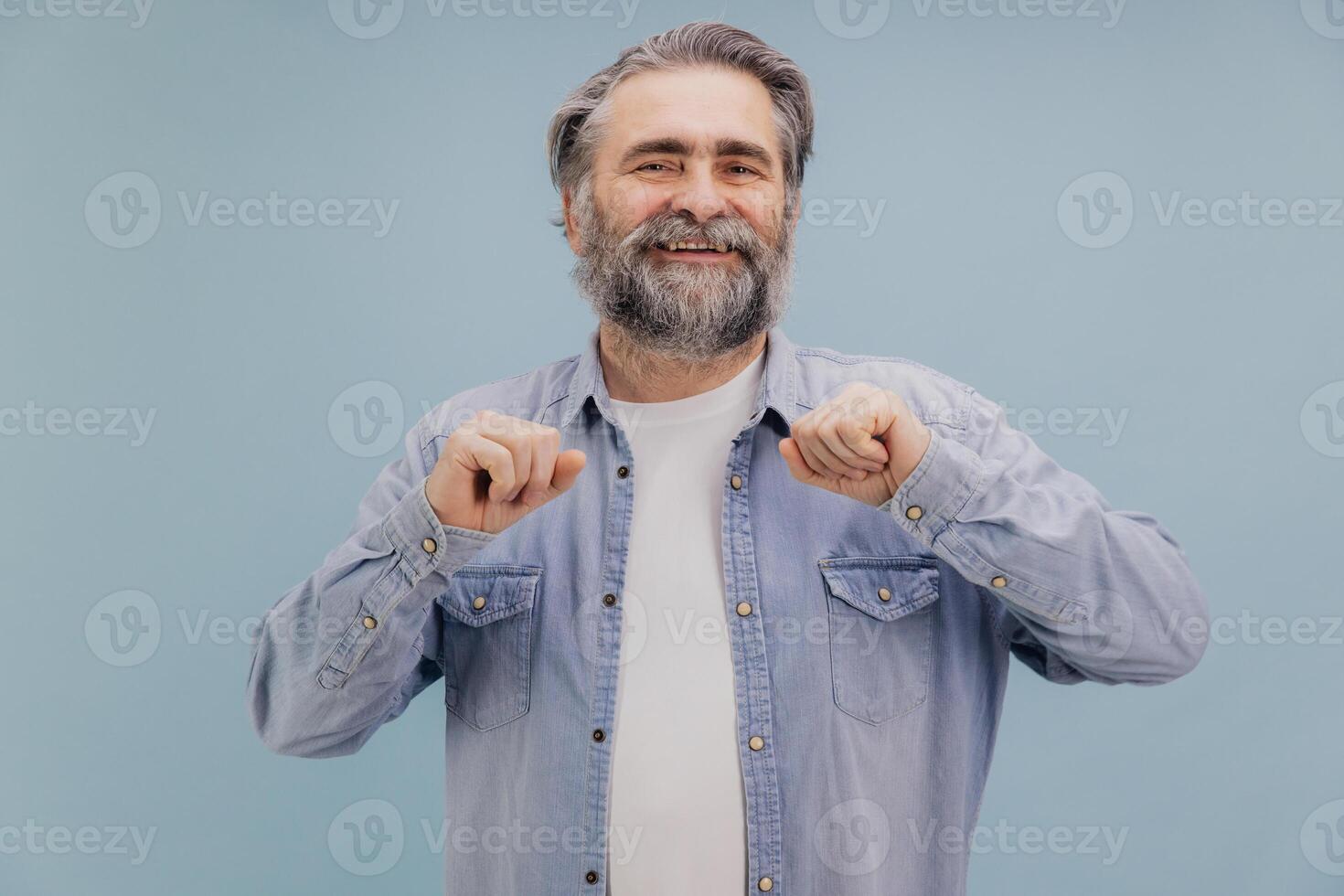 Smiling Senior Man Showing Confidence and Happiness on Blue Background photo