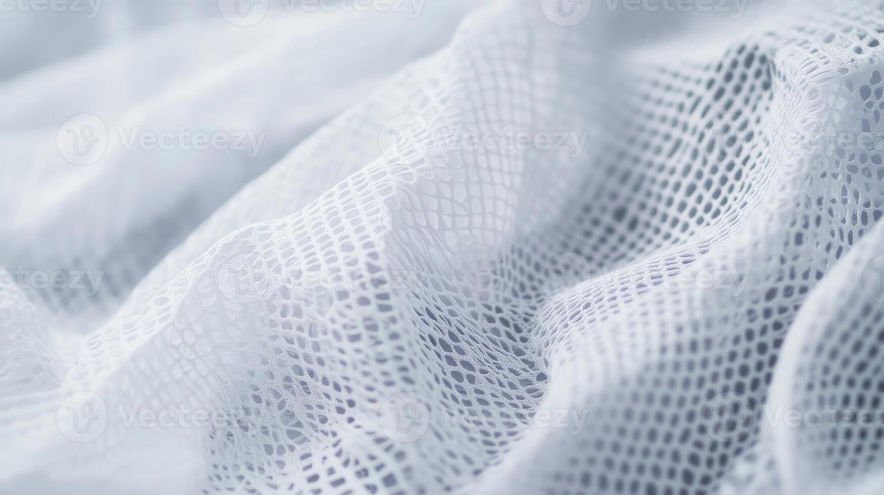 Soft white mesh fabric draped elegantly, showcasing its delicate texture and airy quality in natural light photo
