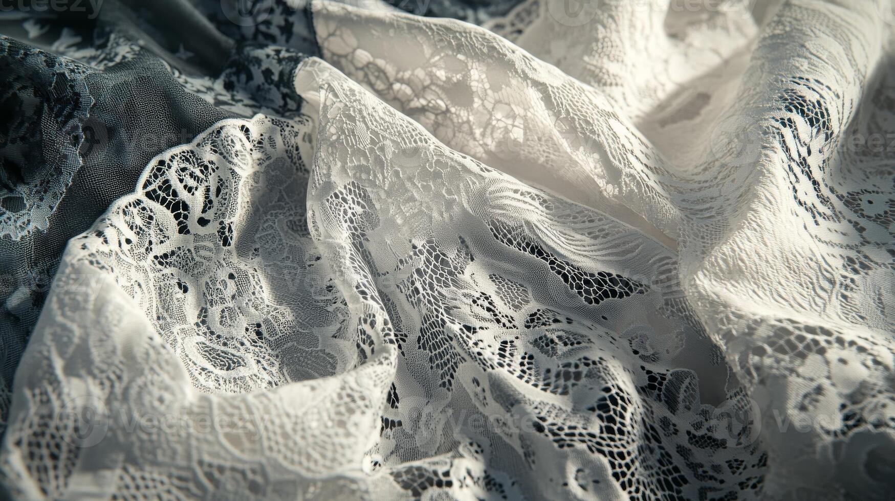 Delicate lace fabrics in white and black display intricate patterns and textures, perfect for various fashion and decor projects photo