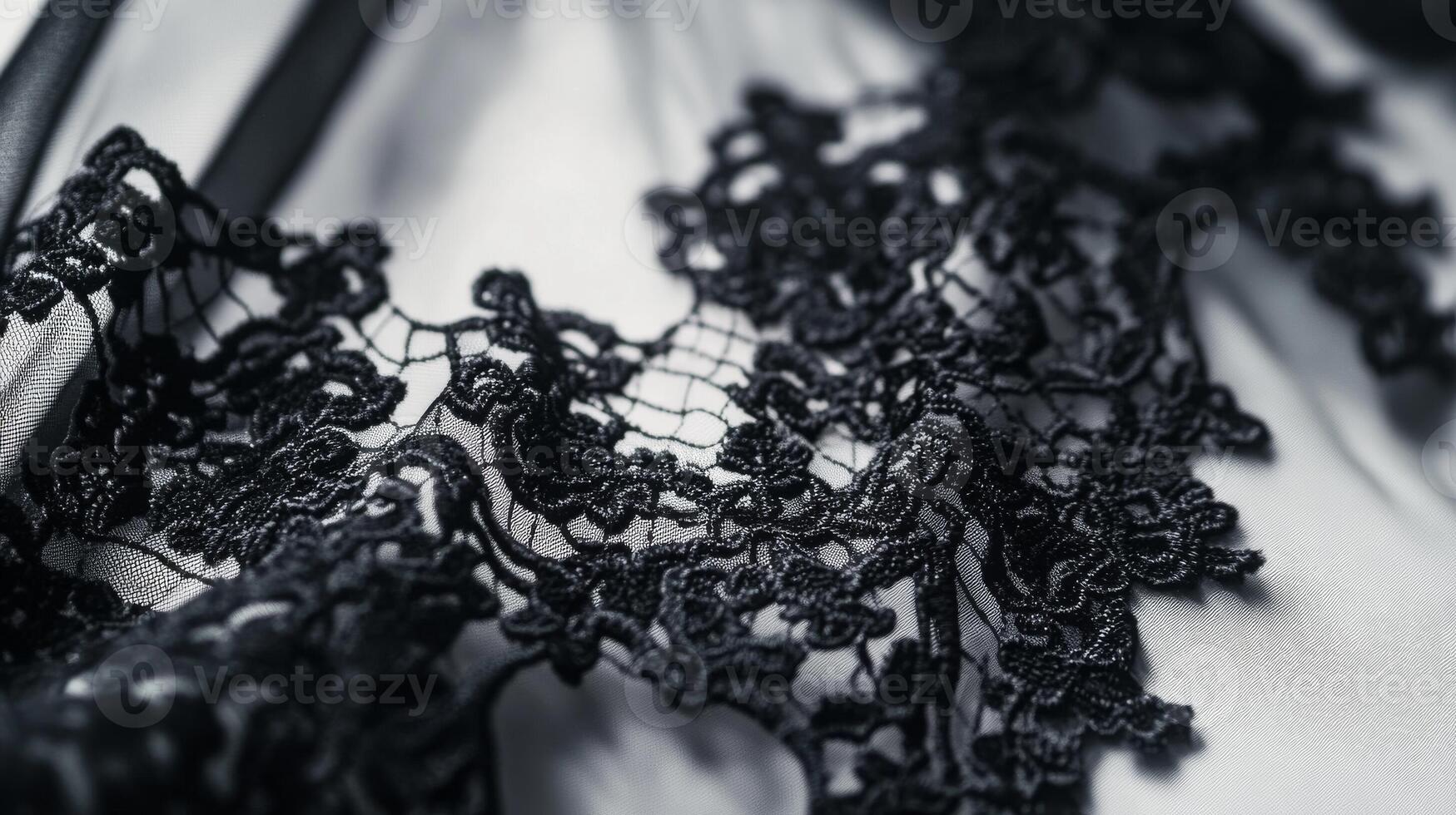 Elegant black lace fabric intricately woven with floral patterns for fashion and design projects photo