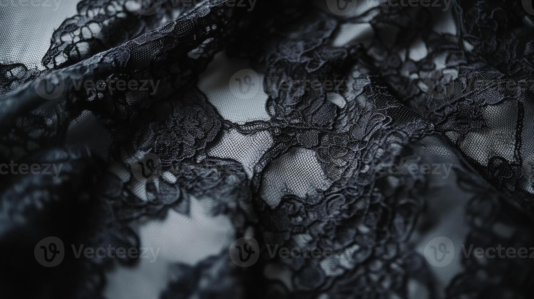 Delicate black lace fabric with intricate floral patterns on a soft background capturing elegance and sophistication photo