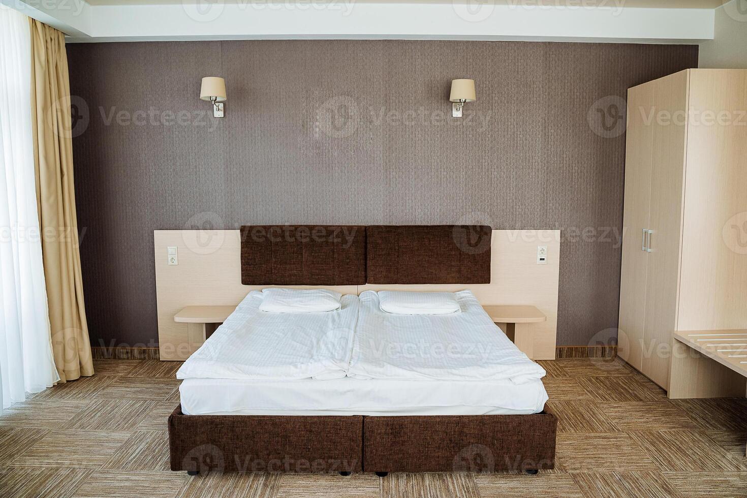 A bedroom with two beds and a dresser photo