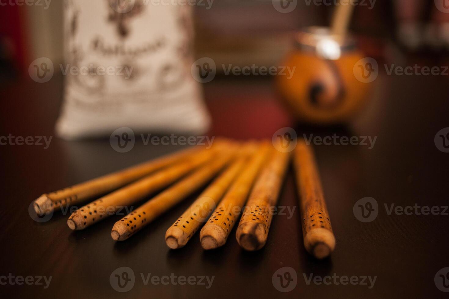 A group of wooden sticks sitting on a table photo