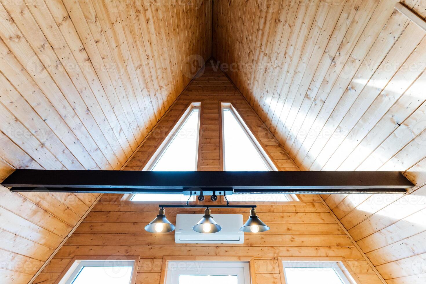 The interior of a tiny house with a ceiling fan photo