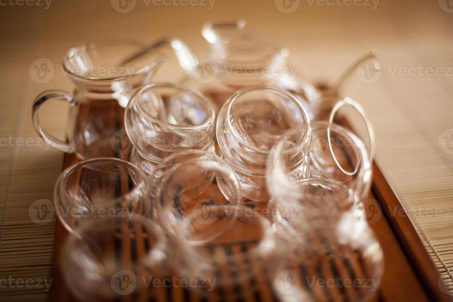 A wooden tray with many empty cups on it photo