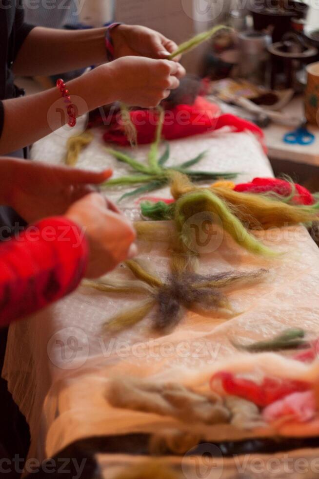 A woman is cutting a piece of fabric photo