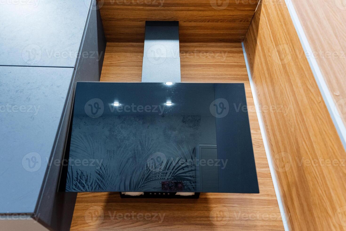 A black stove top in a kitchen photo