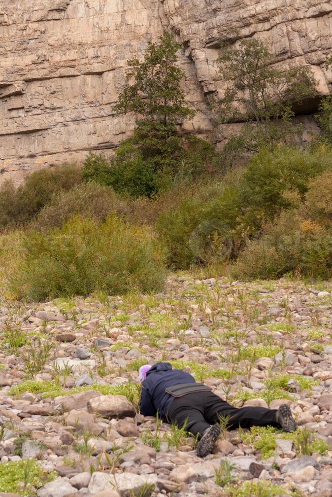 A person laying on the ground photo