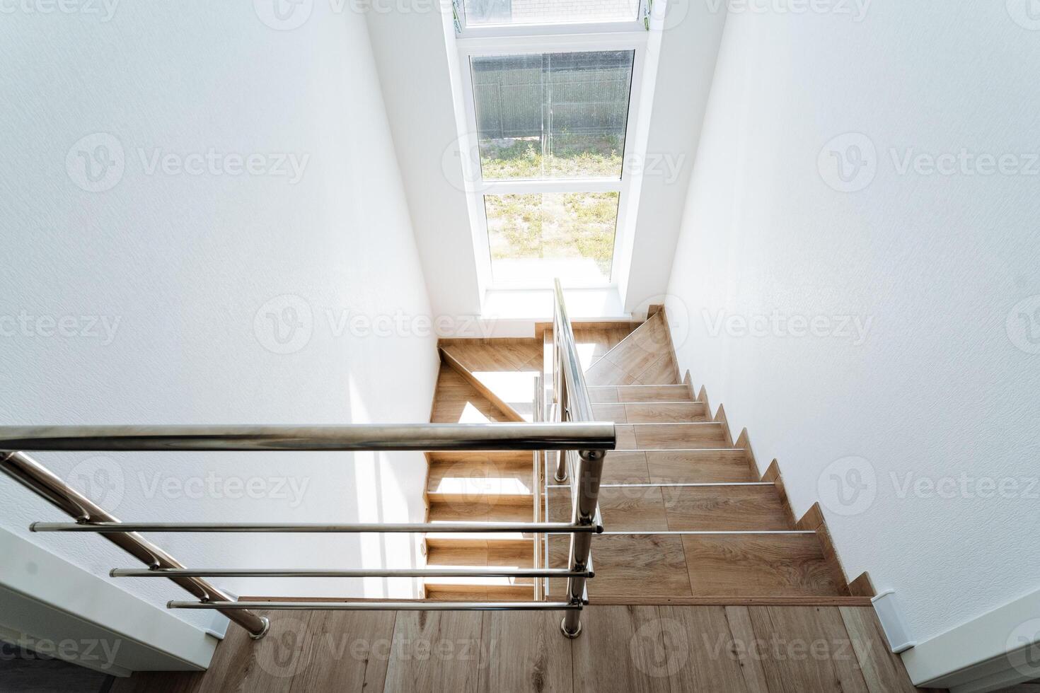 A wooden floor and a metal railing photo