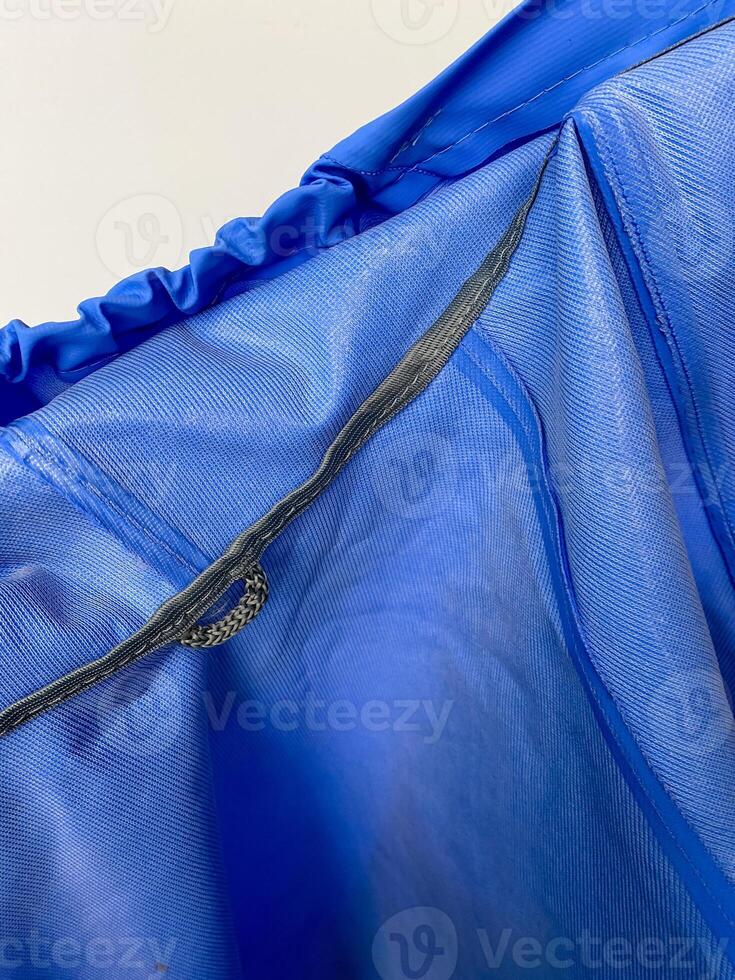 A blue bag with a zipper on it photo