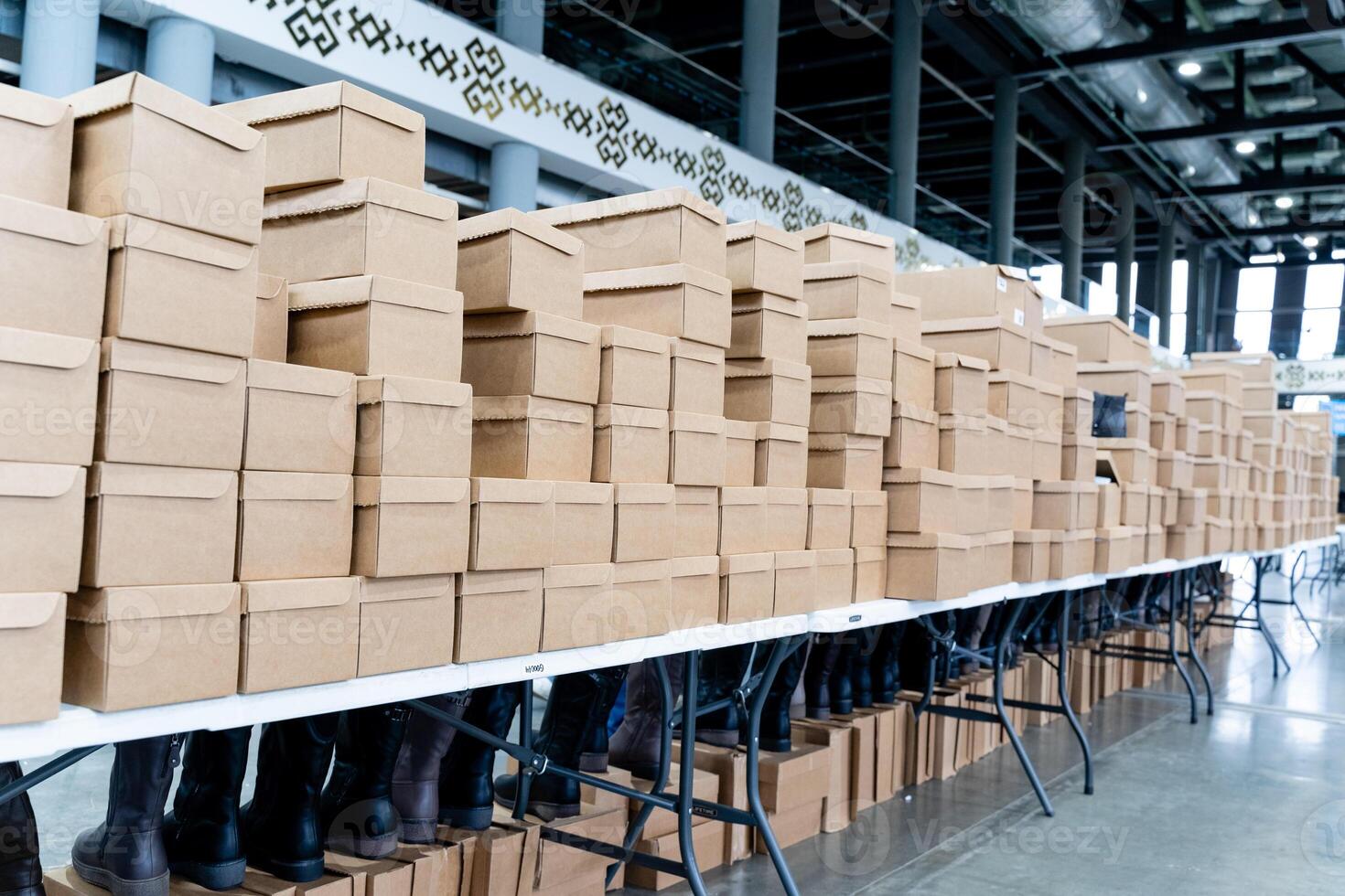 A large table with boxes stacked on it photo