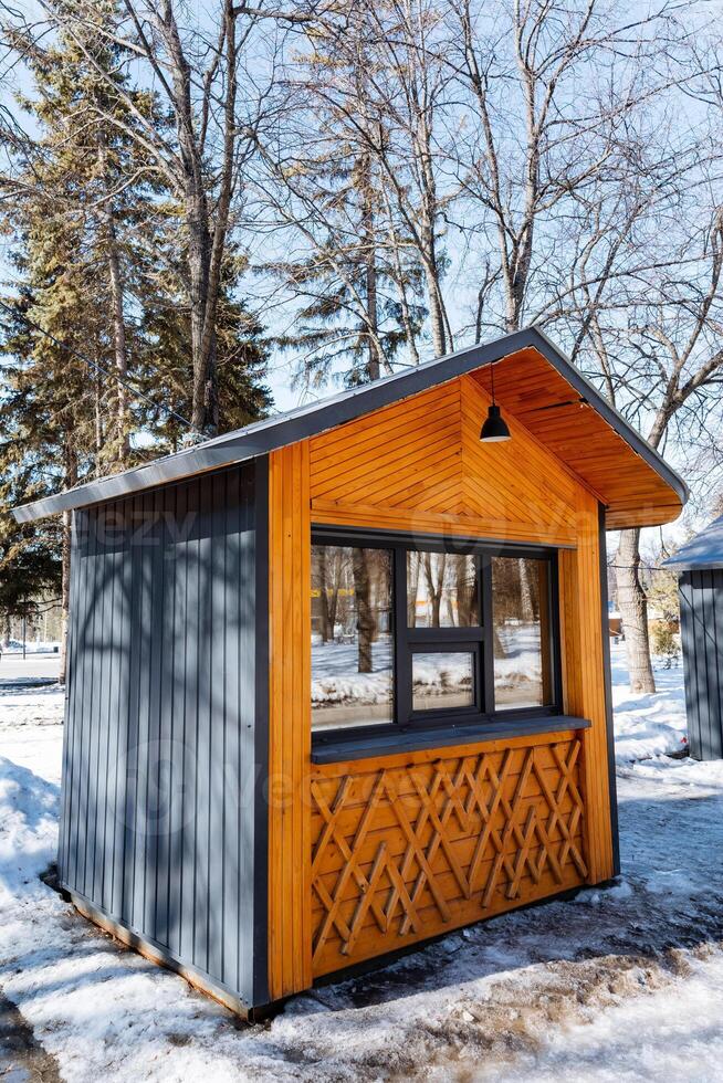 A small cabin with a window and a door photo