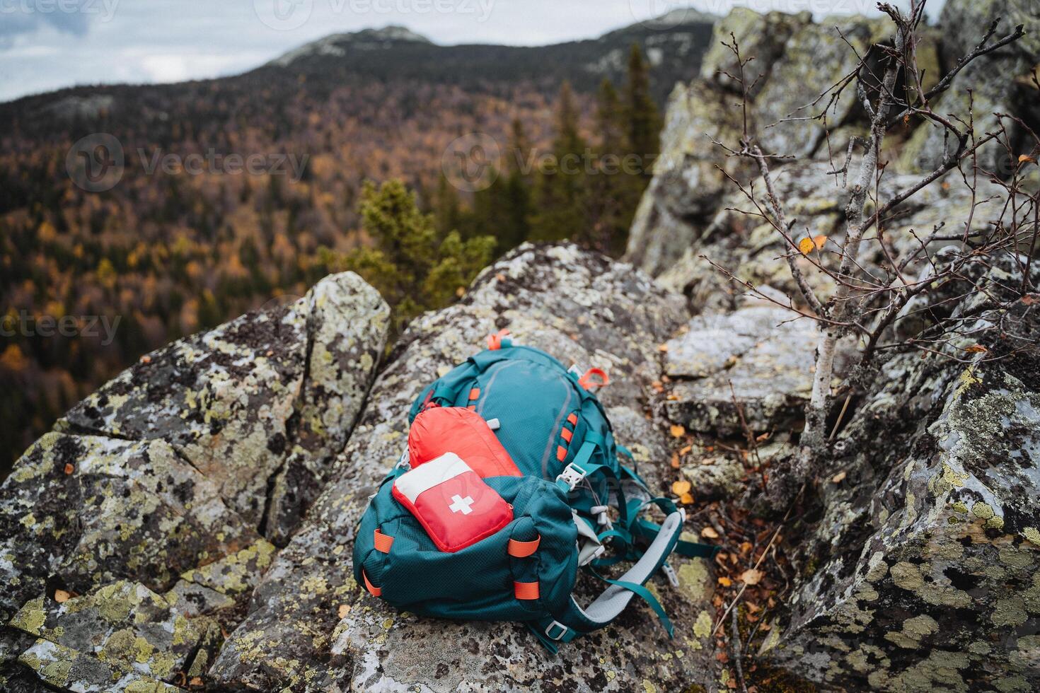 A backpack on a rock in the mountains photo