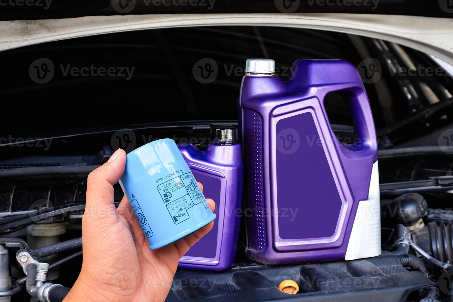 Car maintenance supplies with oil filter and engine oil containers , Car maintenance concept photo