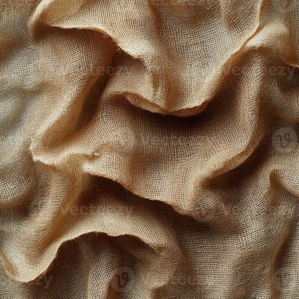 Close-up of beige textured fabric with wavy folds in soft light photo