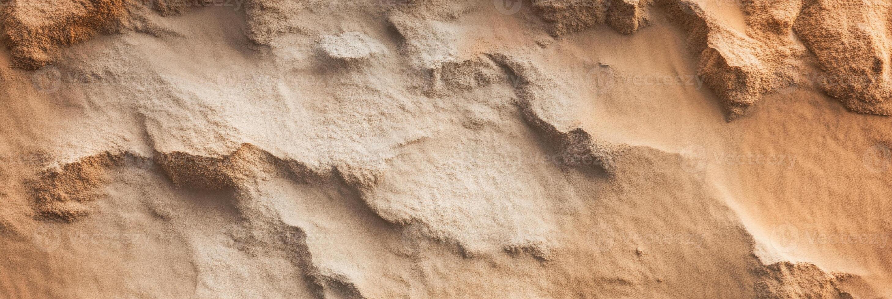 Textured sandy dunes with natural erosion patterns and soft contours photo