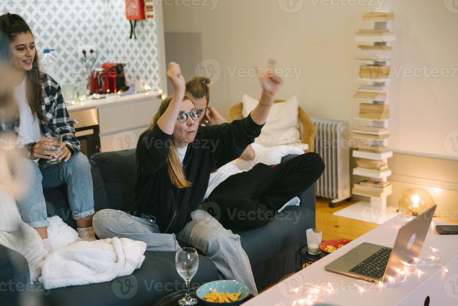 A Group of Friends Enjoying a Cozy and Relaxing Night In Together in Their Apartment Space photo