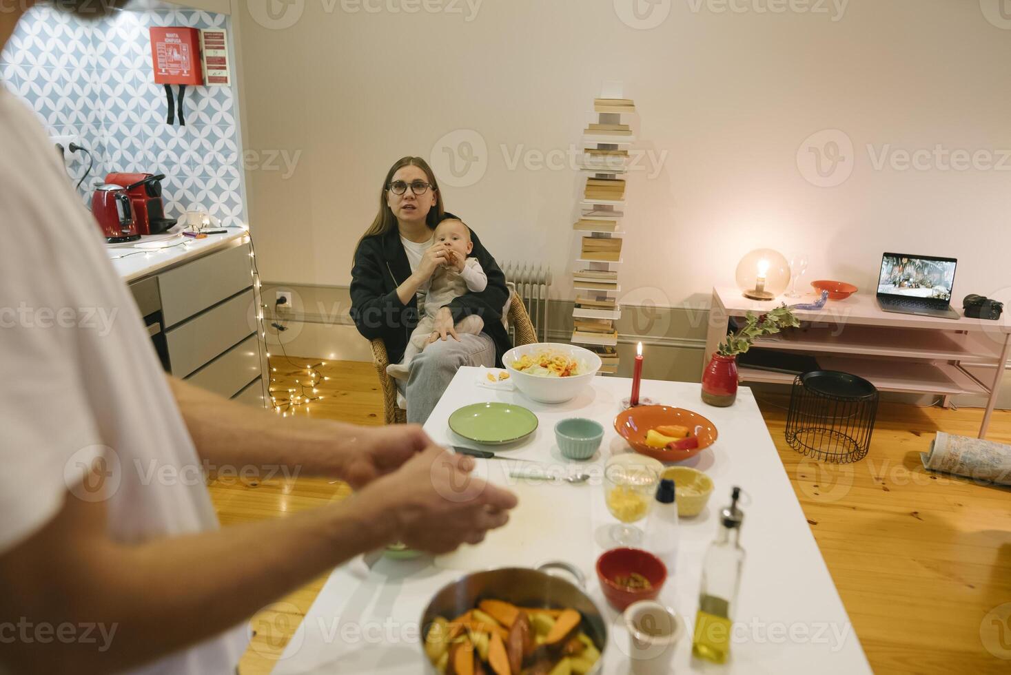 A Cozy Family Moment Enjoying Cooking Together with a Baby at Home in a Heartwarming Environment photo