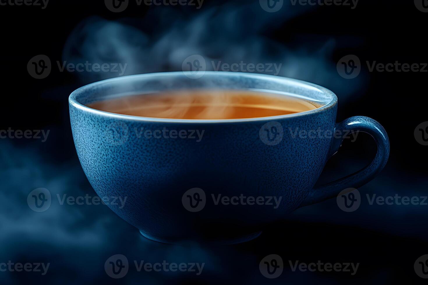 Steaming Hot Beverage in Blue Ceramic Cup on Dark Background photo