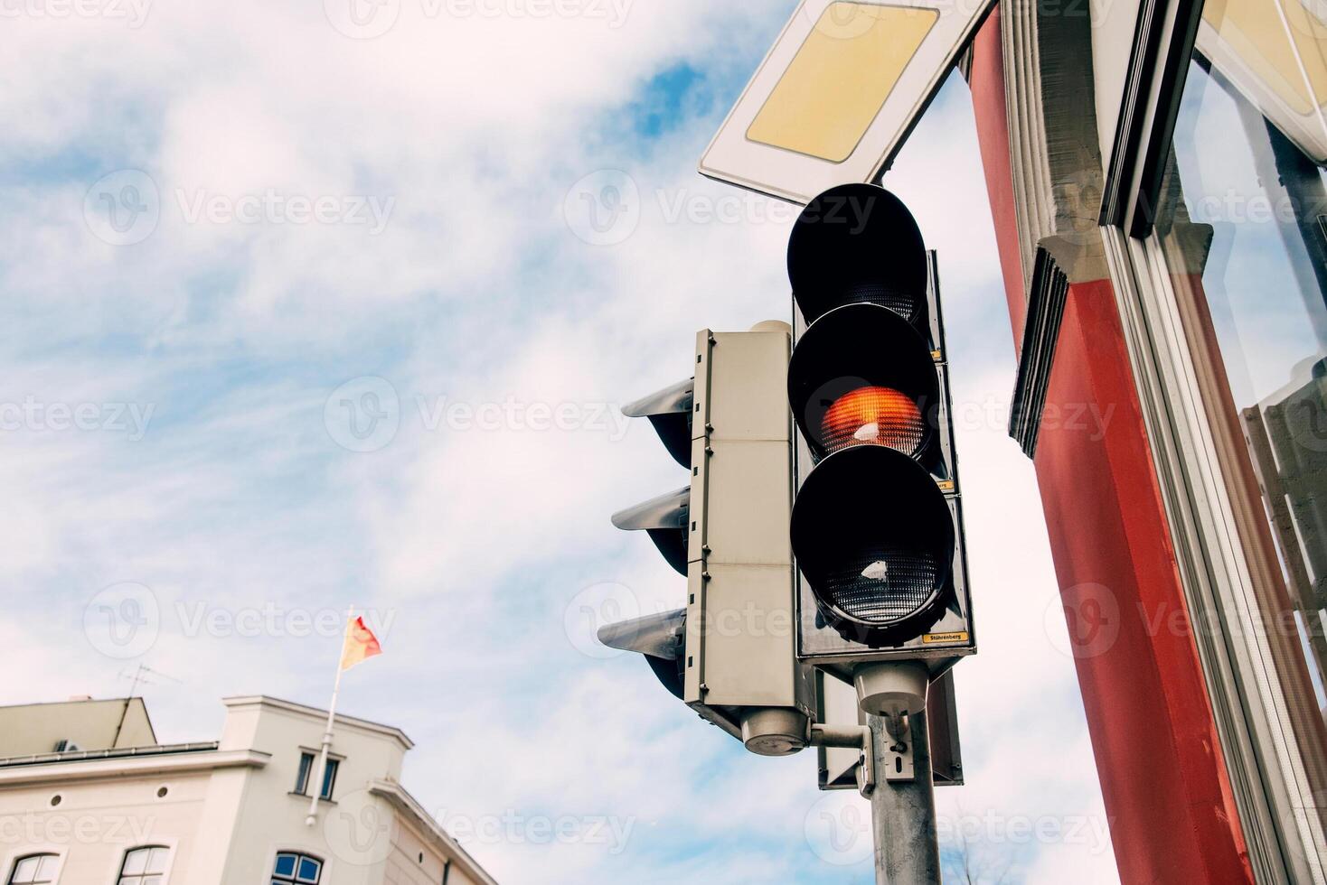 Red traffic nice light for pedestrians, semaphore background foggy autumn sky photo