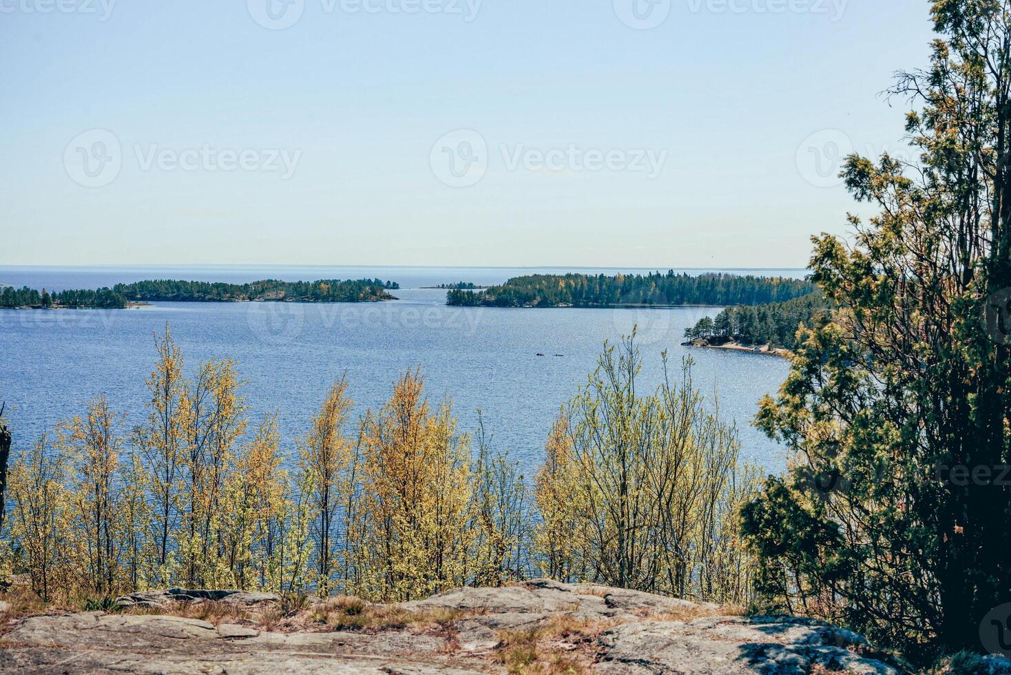 Landscape blue deep lovely lake light sun, clouds sky mountains Ladoga skerries Karelia photo