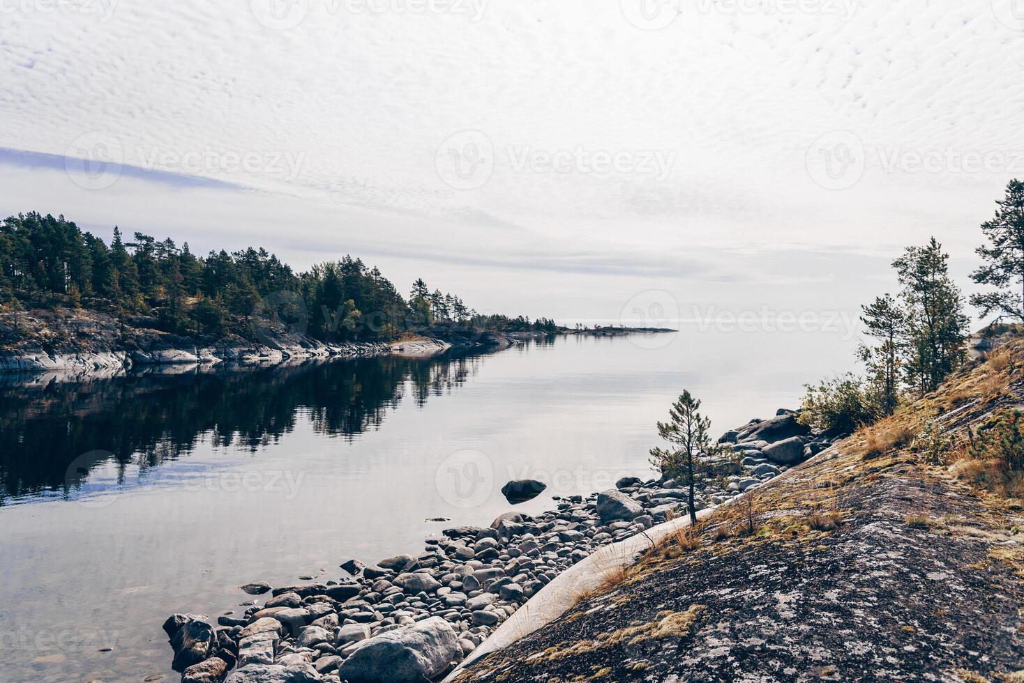 Landscape blue deep lake light sun, clouds sky mountains Ladoga skerries handsome Karelia photo