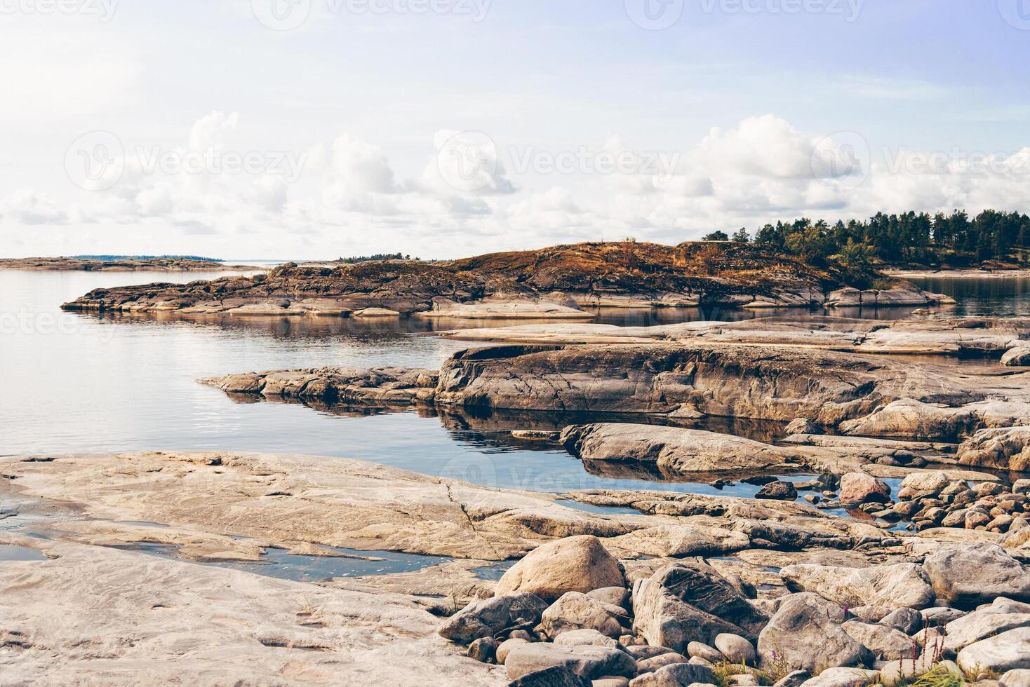 Landscape blue deep lake light sun, clouds handsome sky mountains Ladoga skerries Karelia photo