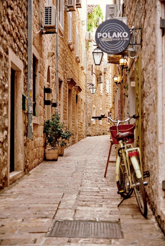 Budva, Montenegro, May 2024, Cobblestone street old part handsome city, road to fortress photo