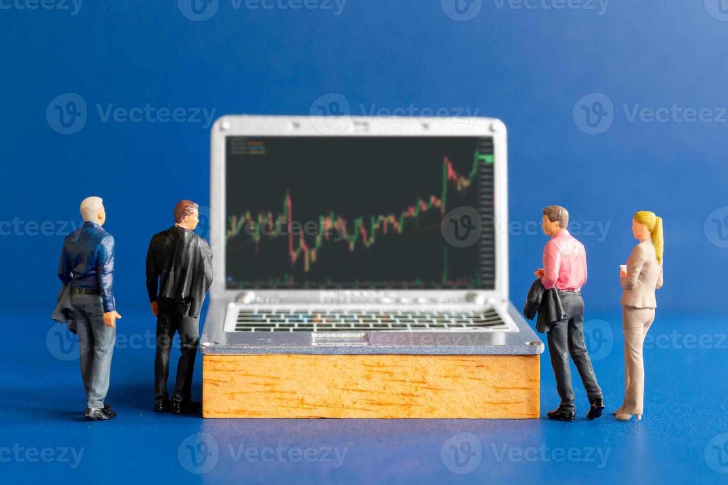 Business people consulting and tablets featuring stock tickers photo
