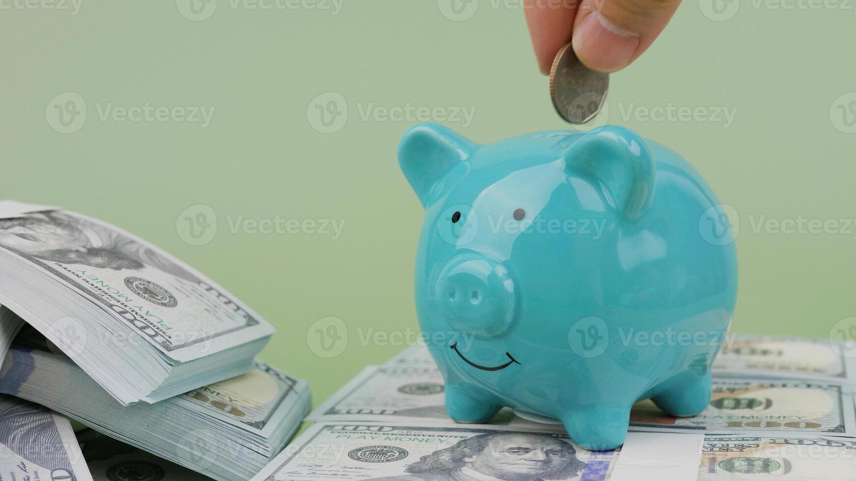Saving coins in a piggy bank, income from working to earn money, generating income and investing in finance. photo