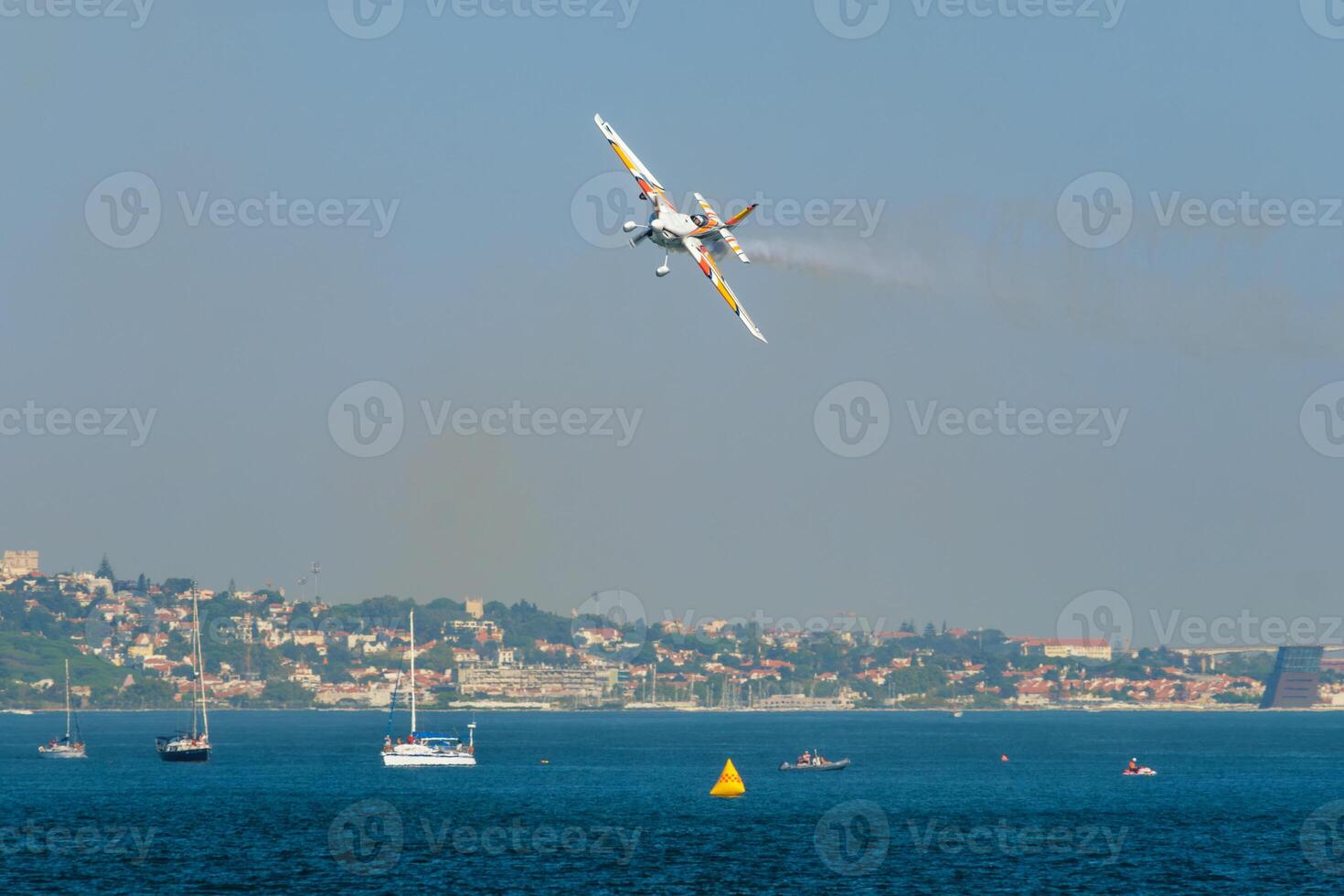 Stunt aerobatic plane performing stunts in air photo