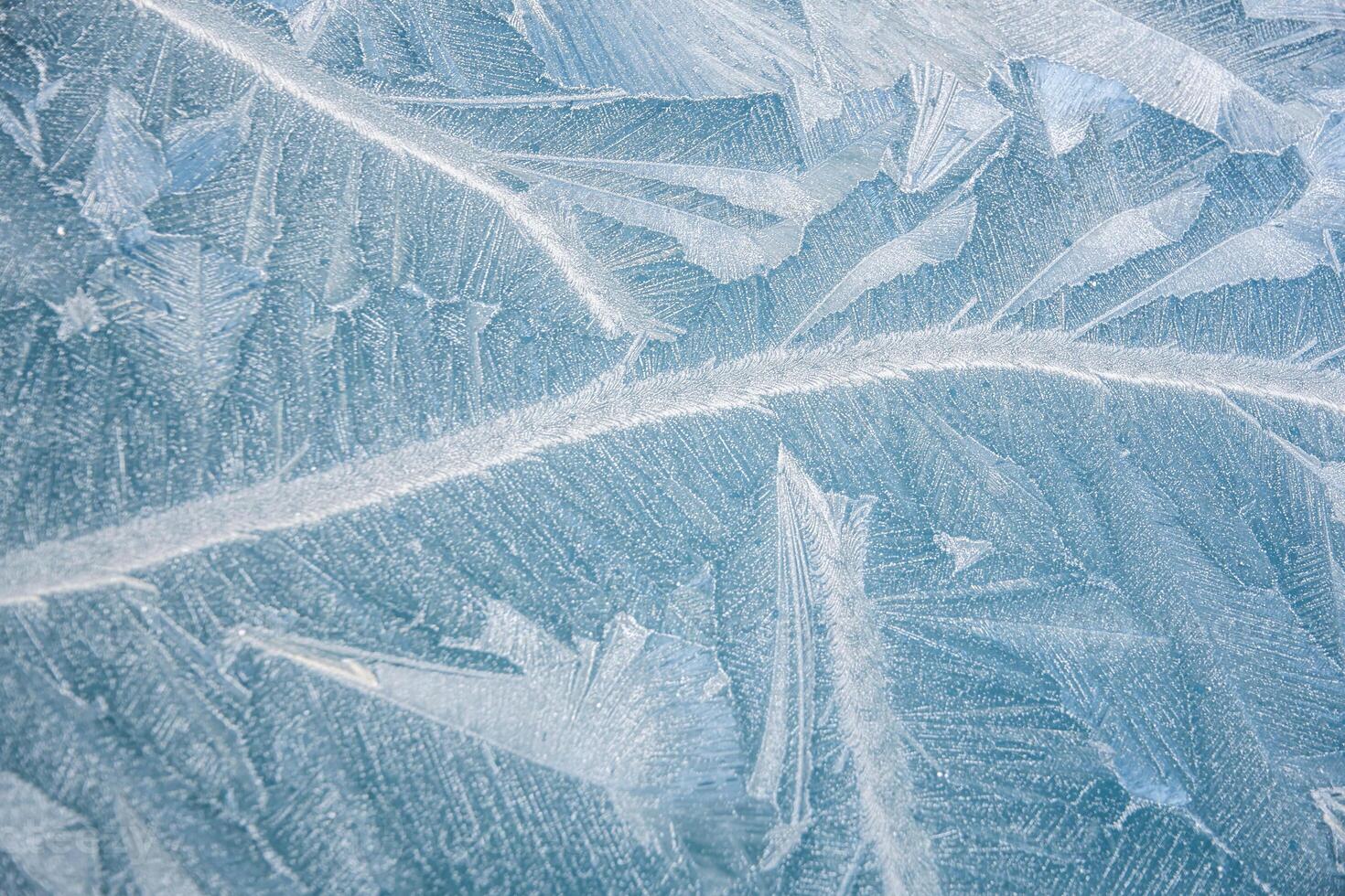 nature draws frost patterns on the glass with the freezing air temperature,abstract winter pattern photo