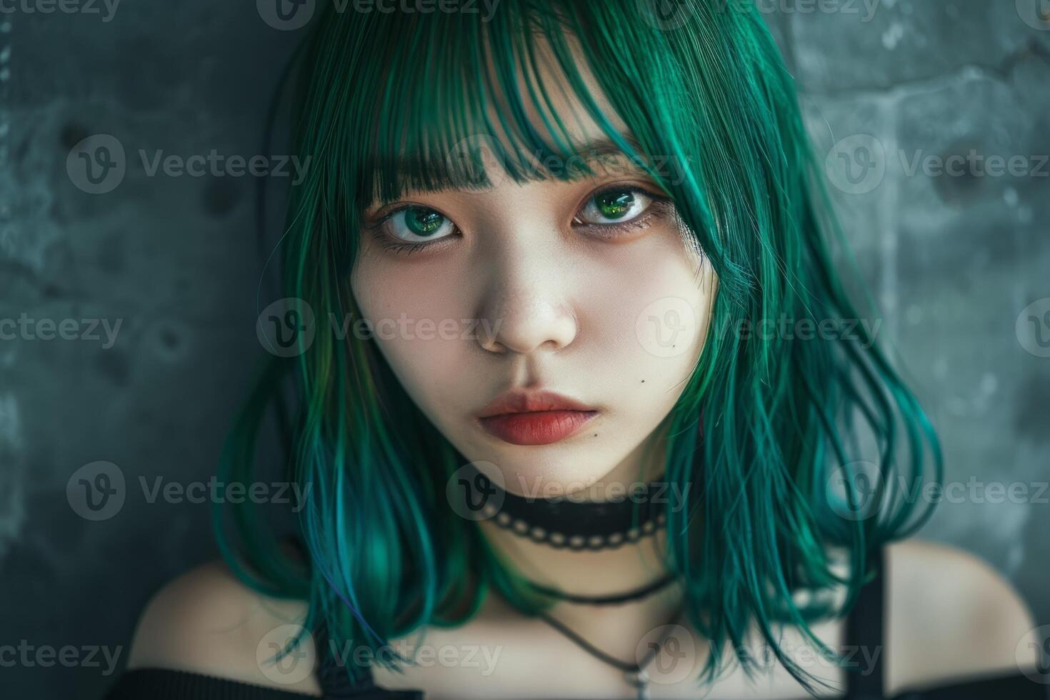Young woman with green hair in moody lighting photo