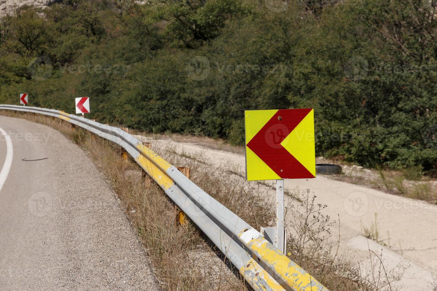 Curved road sign along Gorgan Bojnord road in Golestan National Park Iran photo