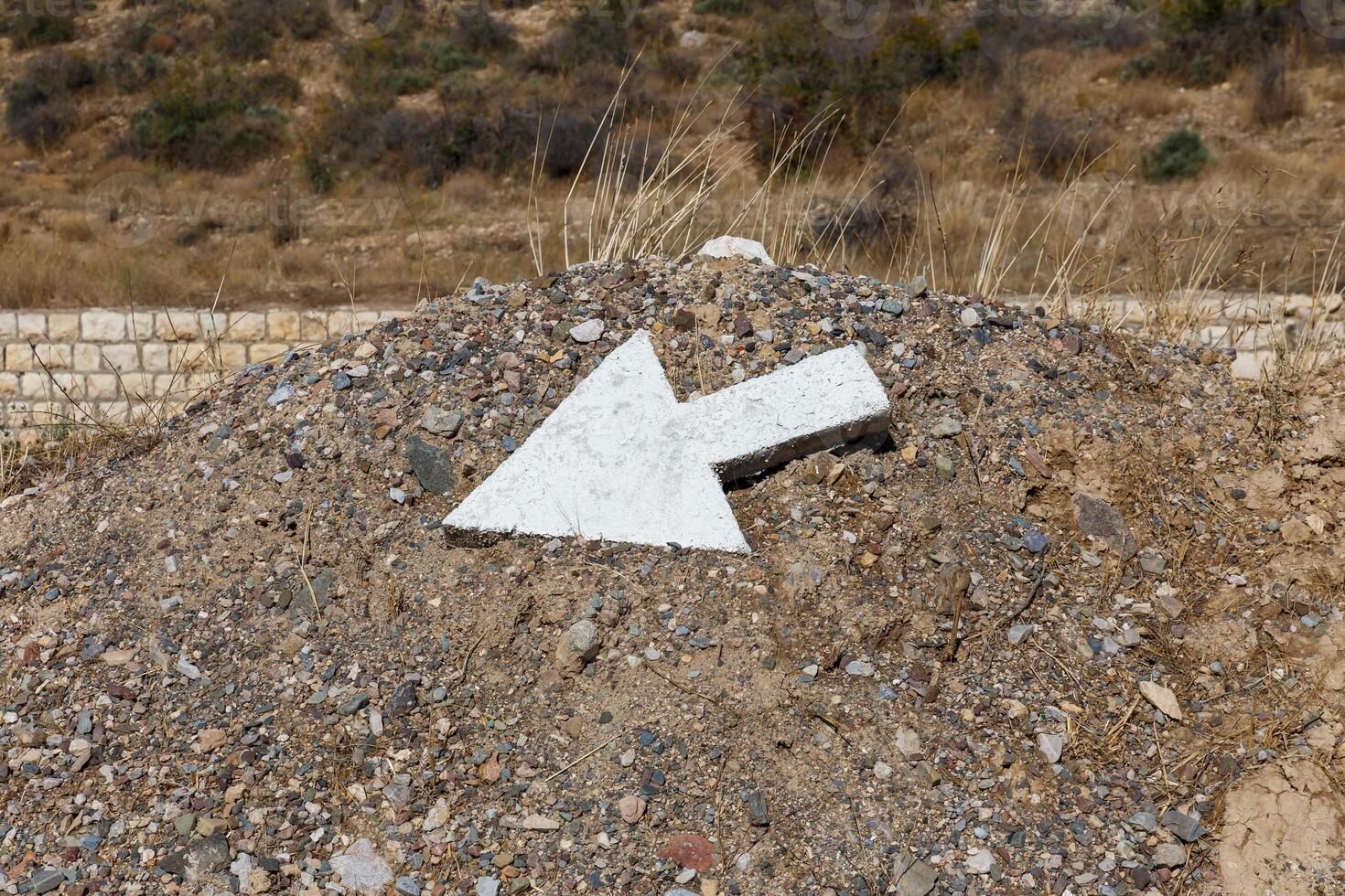 Directional arrow marker on Gorgan Bojnord road in Iran indicating travel route photo