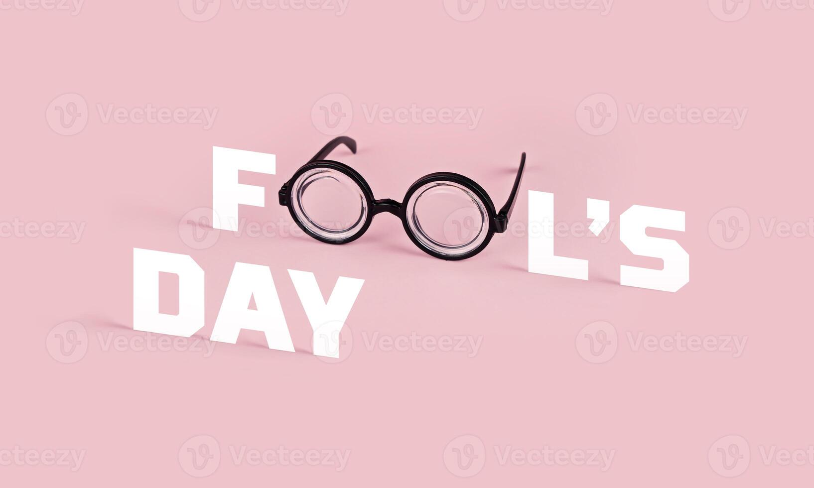Greeting card for April Fool's day. Funny goggles with round glasses on pink background and the word FOOL, concept, copy space photo