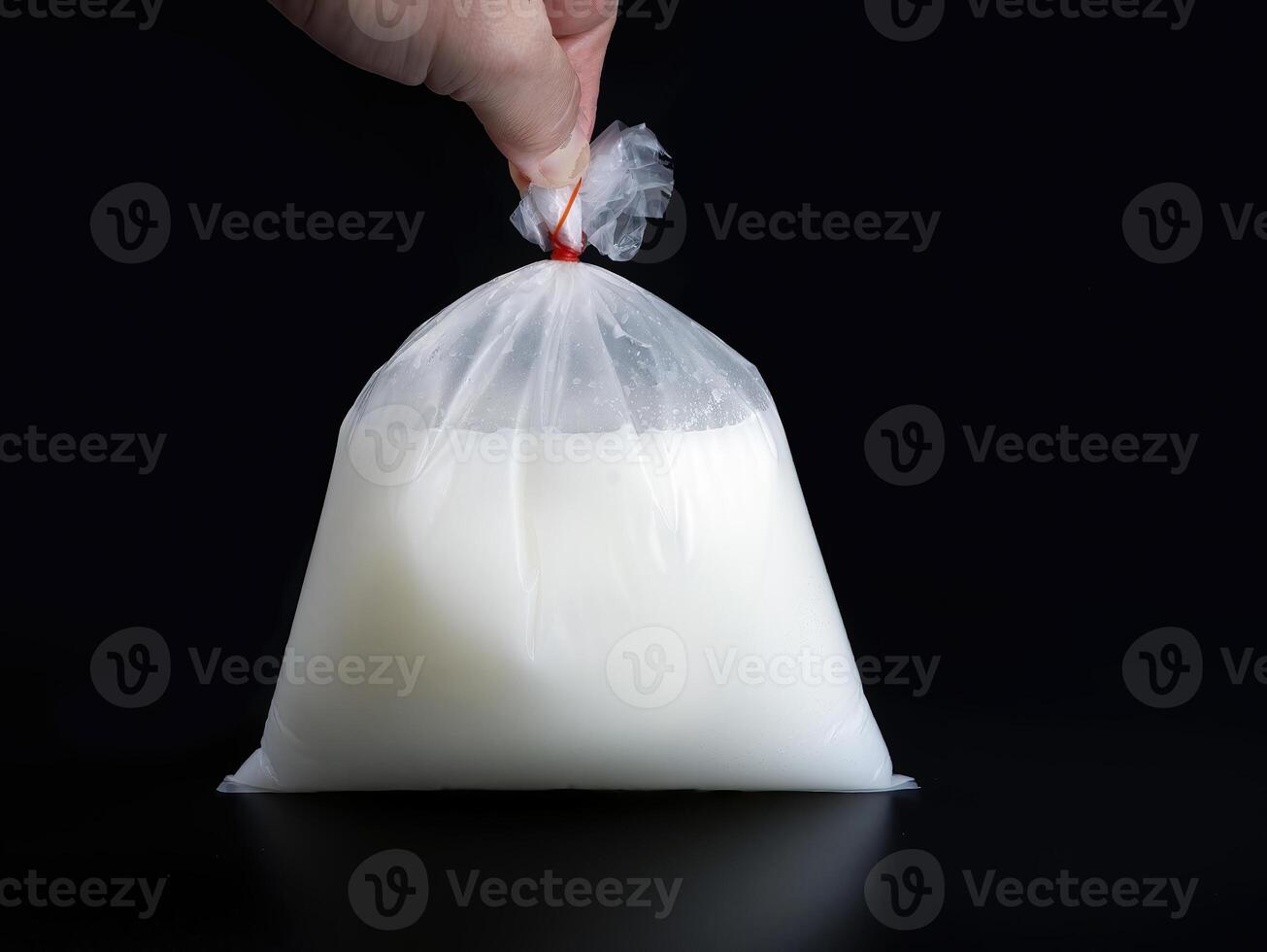 Local herbal drink, Only in Thailand, transparent plastic bag tied with rubber band, food package in traditional Thai style, takeaway or delivery food business, pollution concept photo