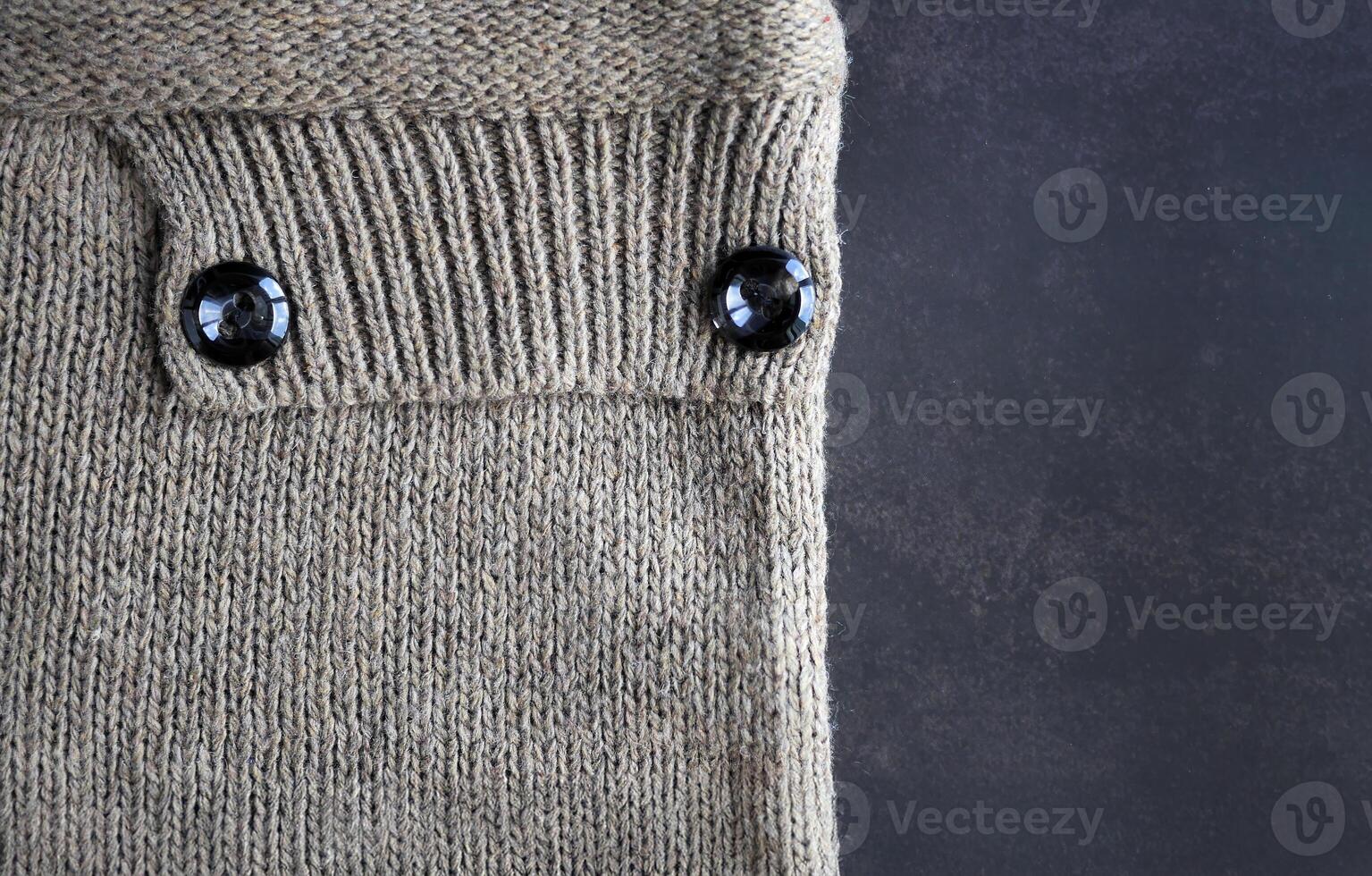Texture pattern Knitted Woolen, knitting fabric, knitwear Fabric, earth tone color craft work, for background backdrop or wallpaper with space photo