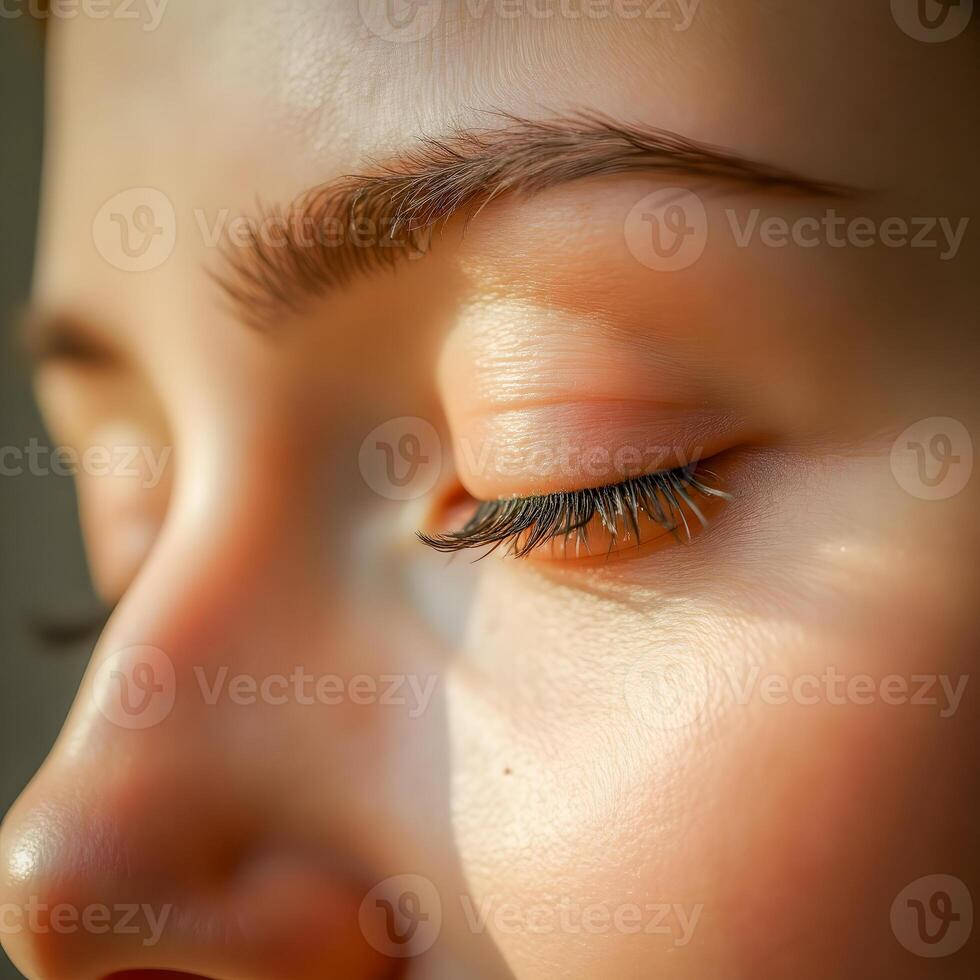 Extreme Close-Up of Woman's Eye Showcasing Eyelash Detail and Skin Radiance photo