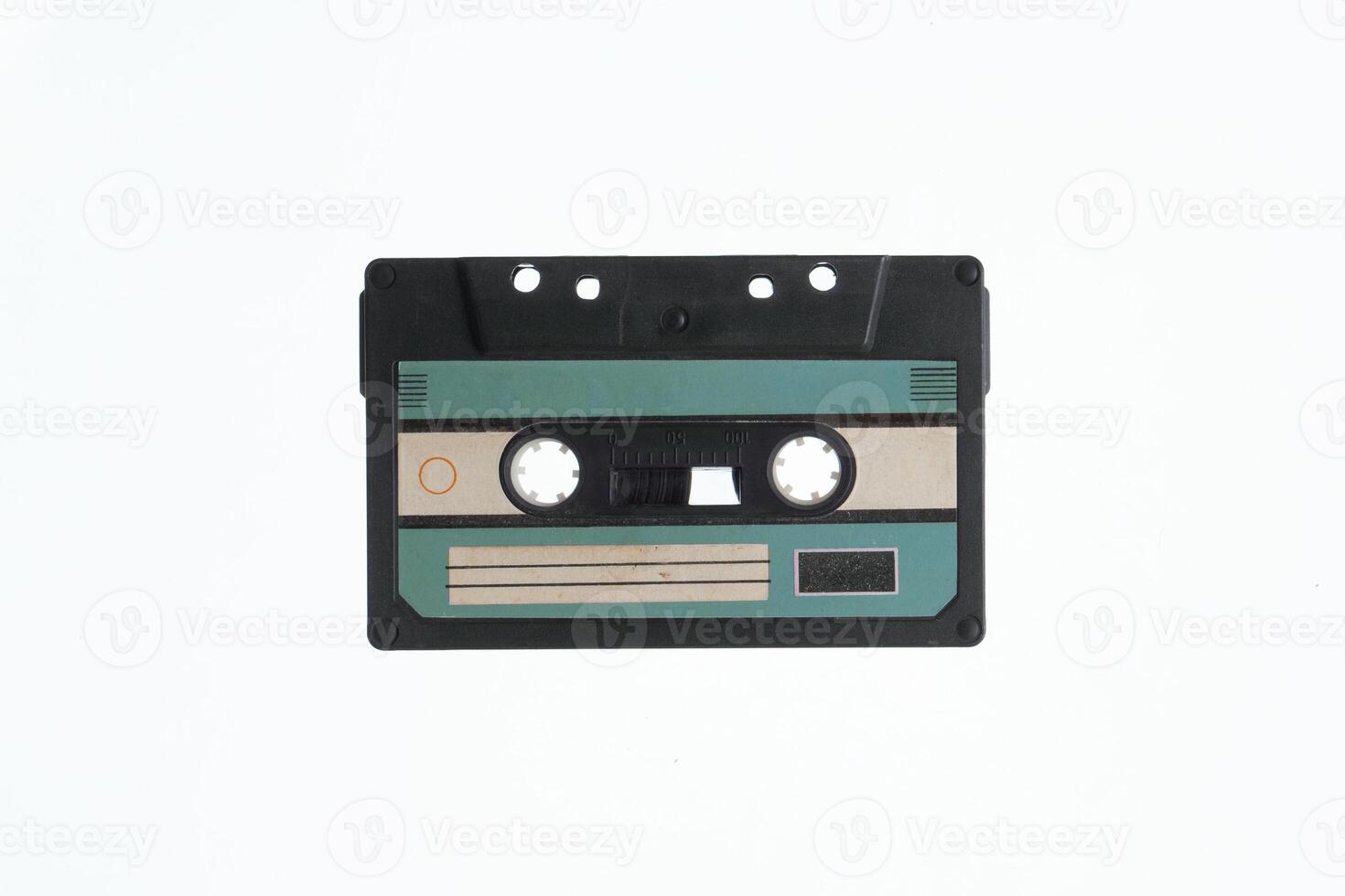 A vintage audio cassette tape with an blue and black label, isolated on a white background, evokes nostalgia and retro vibes. photo