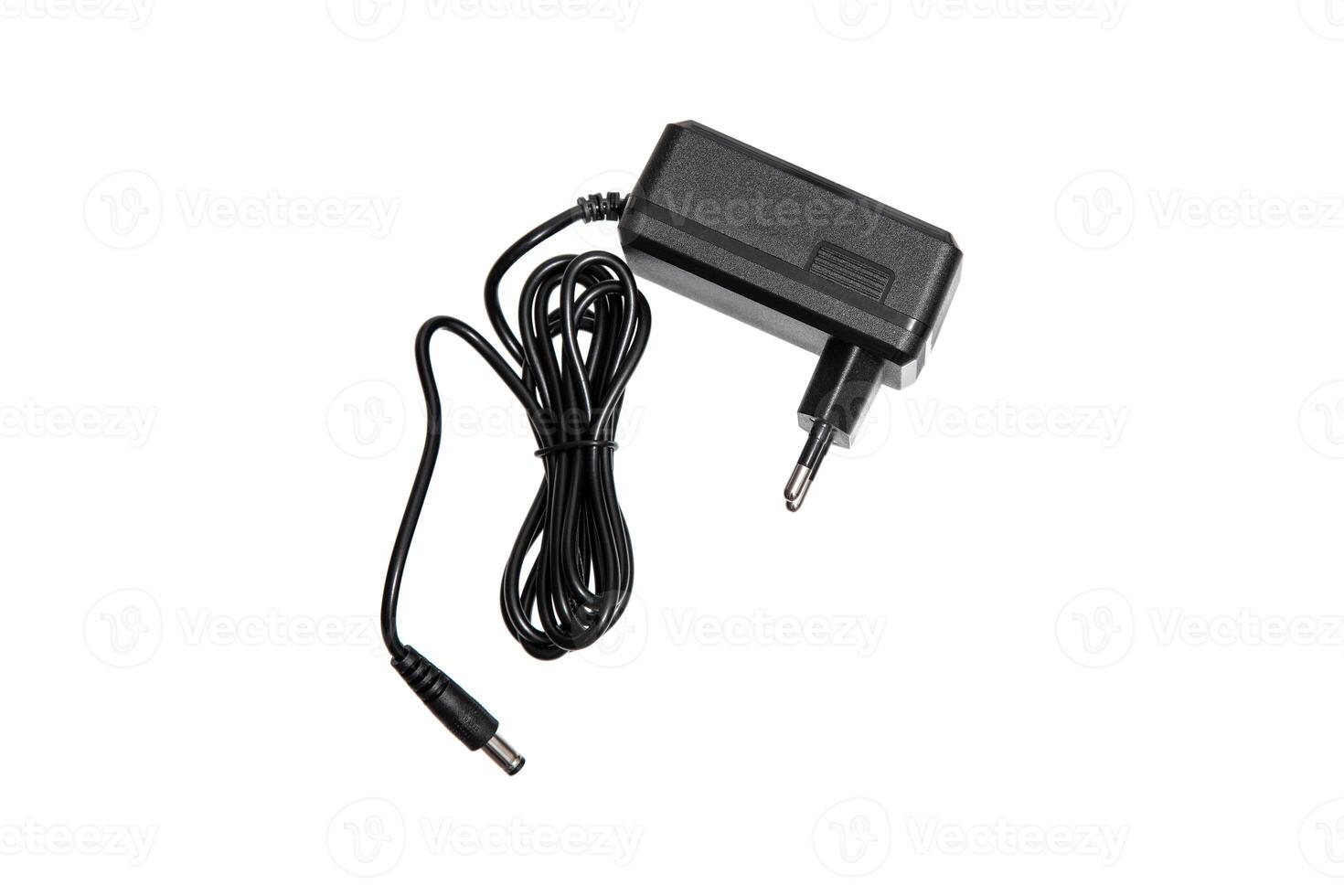 A black power adapter with a coiled cable, isolated on a white background. photo
