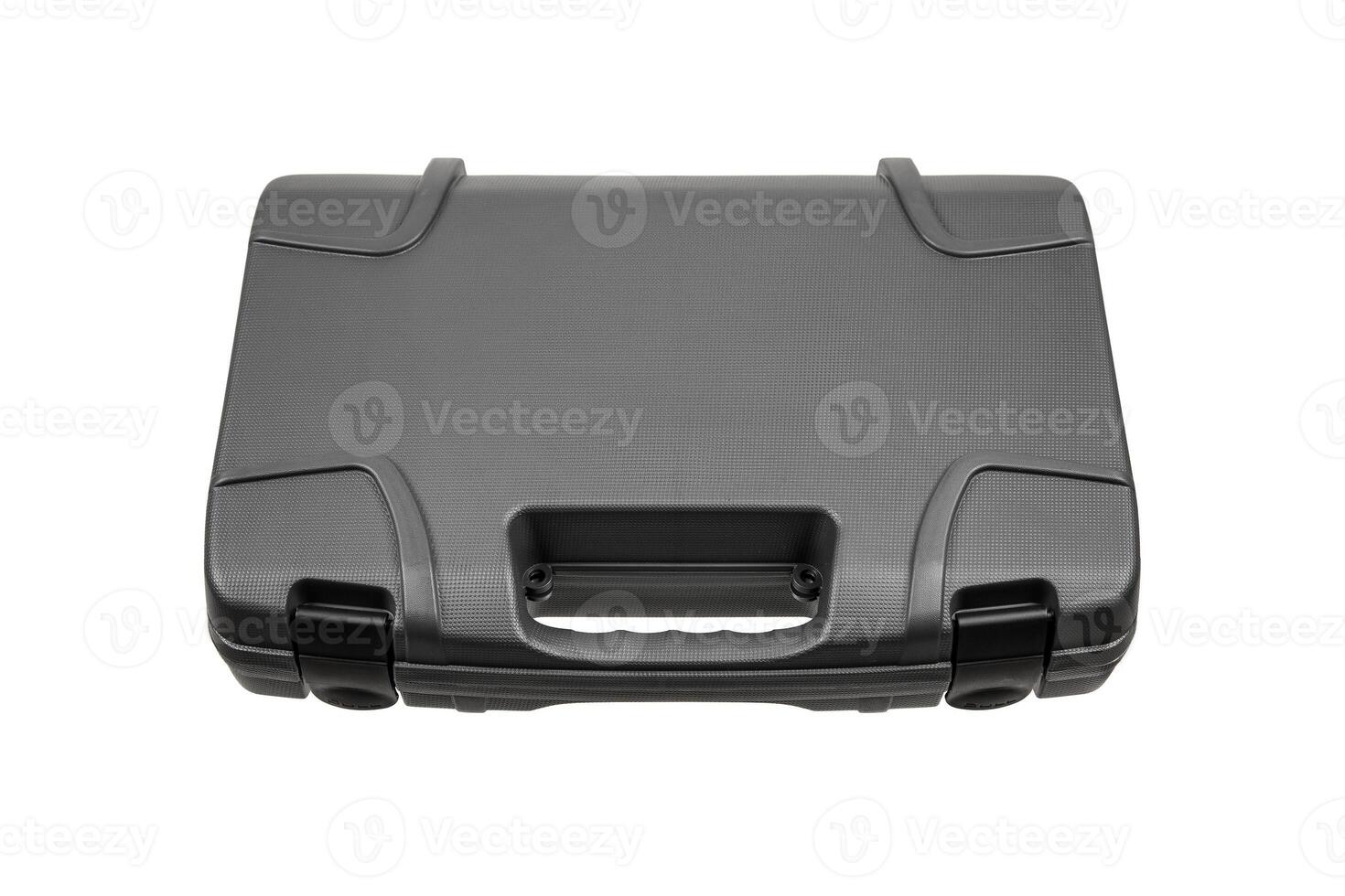 Gray, hard plastic suitcase with textured surface, handle and secure latches, isolated on white back photo