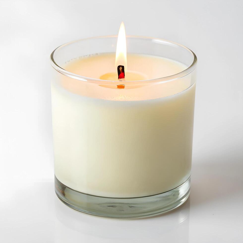 small scent candle lit with calm flame photo