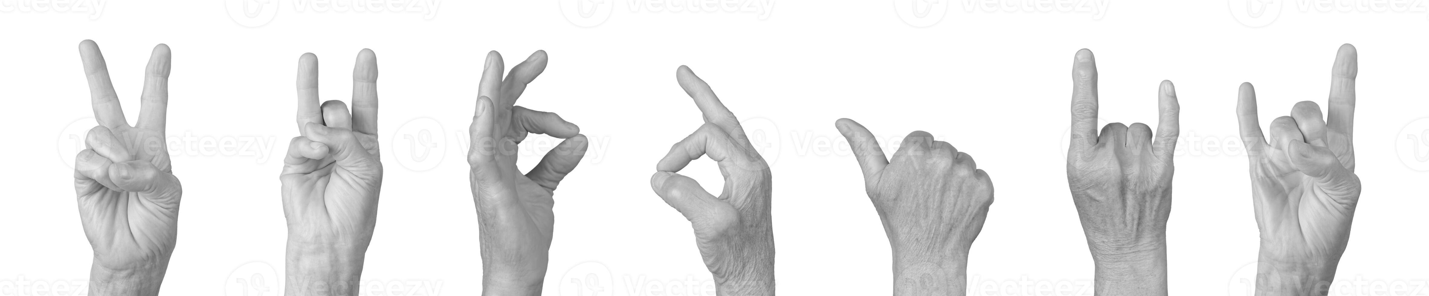 Elderly female hand showing gestures like peace, victory, and rock horn, thumb up, and clenched fist photo