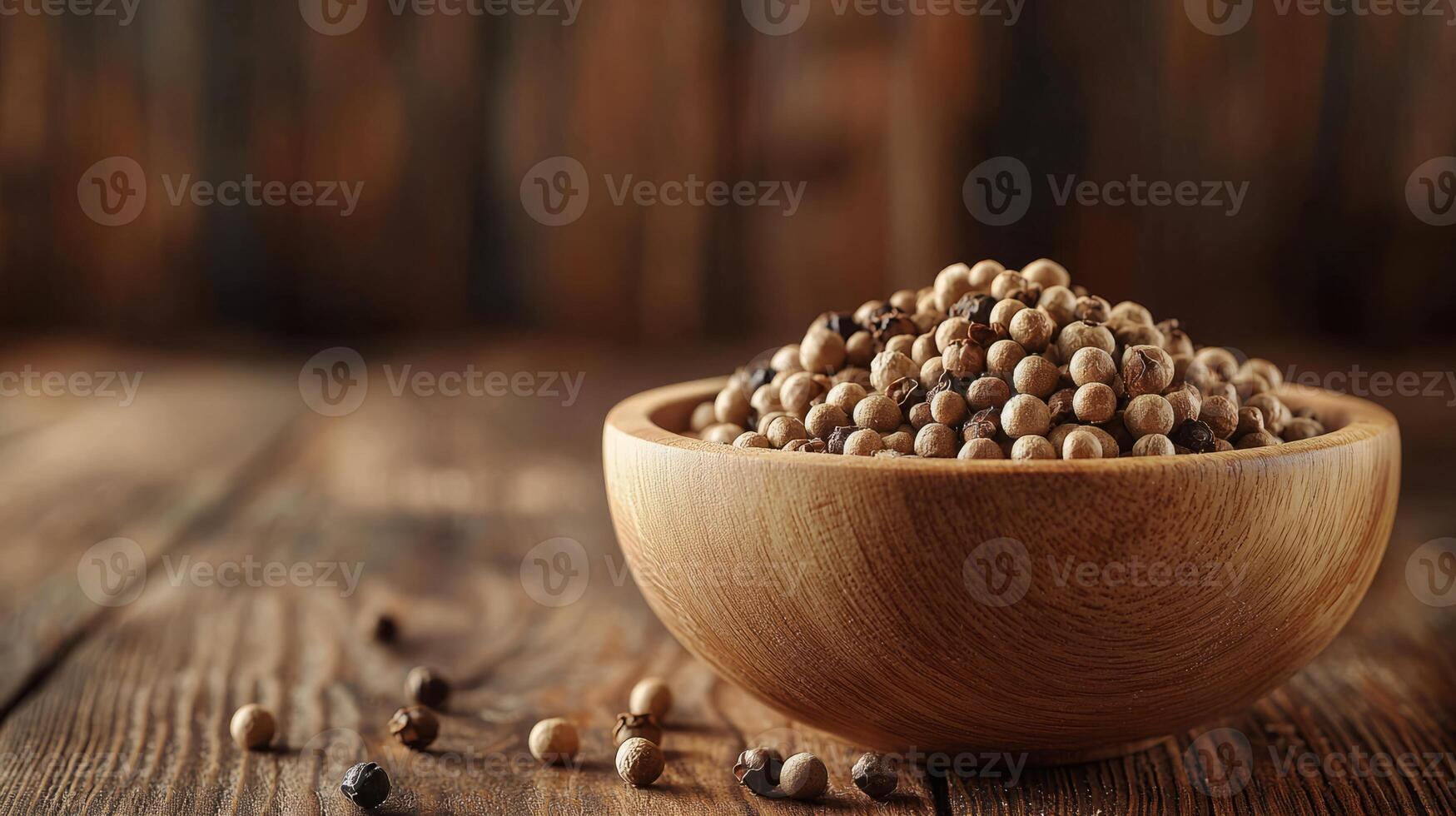 Hemp seeds in a wooden bowl on a wooden table photo