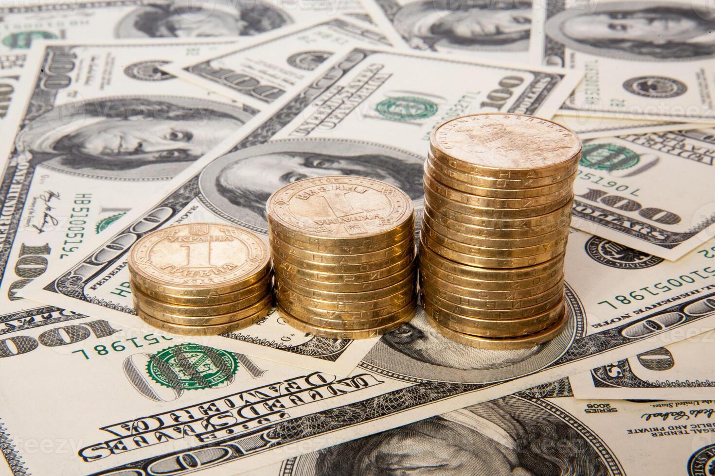 coins of Ukrainian hryvnias and dollars photo